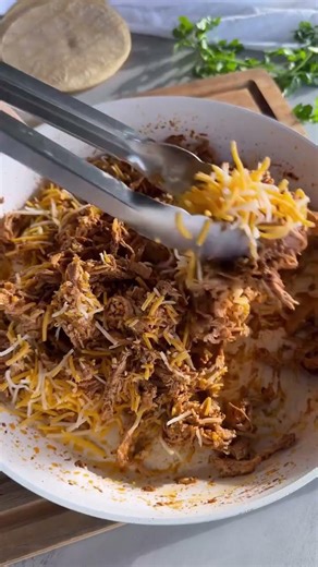 Crispy BAKED CHICKEN AND CHEESE TAQUITOS made with corn tortillas, seasoned shredded chicken,