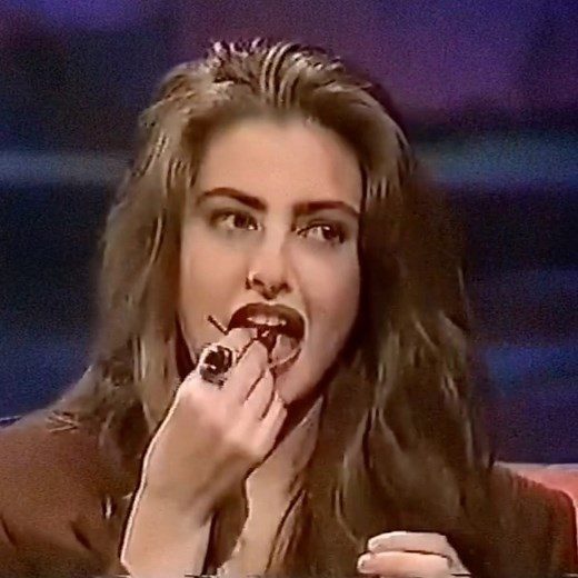 Iconic Daily on Instagram: "Mädchen Amick tying a cherry with her tongue, 1990."