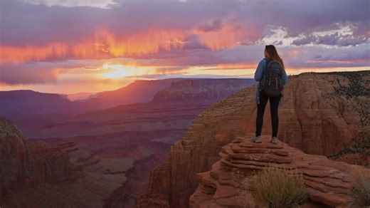 Woman enjoying sunset view at Grand Canyon | Premium Stock Video Footage