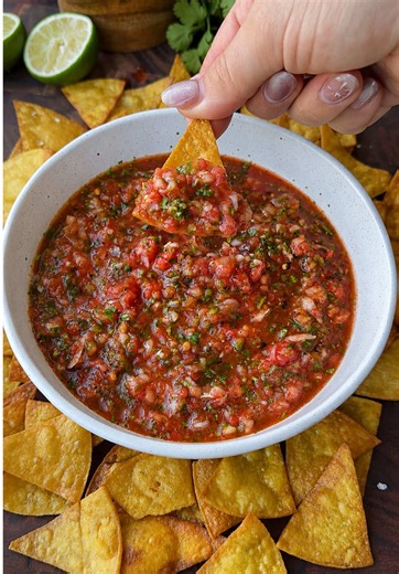 Fresh Homemade Salsa with Crispy Fried Tortilla Chips Fresh, vibrant, and bursting with flavor, this homemade salsa comes together in minutes using simple ingredients and a can of fire-roasted tomatoes for an extra layer of smoky goodness. Paired with warm, crispy tortilla chips fried until golden and sprinkled with flaky salt, it’s the kind of snack that disappears fast. Perfect for game days, summer gatherings, or whenever you’re craving something fresh and delicious. —Salsa Ingredients— 1 sma