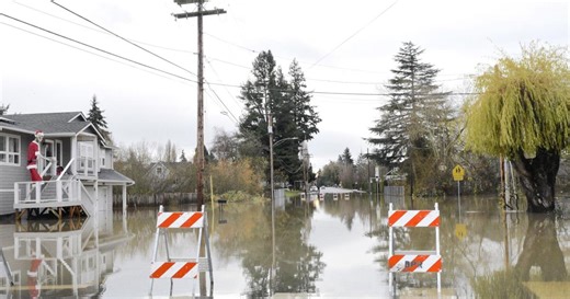 As floodwaters wash through Burlington, residents evacuate