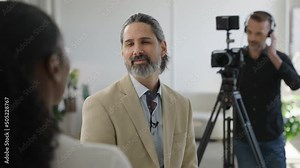 Video Production Interview in Business Setting Corporate Interview. Camera Man Videographer Filming Interview Subjects Talking. Behind the Scenes on Set Stock Video