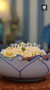 A great way to use up leftover rice, this quick fried rice cooks up with eggs, vegetables and Chinese sauces. Make this quick and easy Fried Rice at home Ingredients: Eggs 1 tbsp Oil Salt Black Pepper 1 cup Basmati rice (cooked) Oil 2 tsp Ginger, crushed 2 tsp Garlic, crushed 1 tsp Chilli flakes 2 Spring Onions, whites 2 tsp Soy sauce Salt Spring Onions, green Vinegar Method of preparation: Heat a wok, add oil, eggs, scramble it quickly and season it with a pinch of salt and pepper. Take it out 
