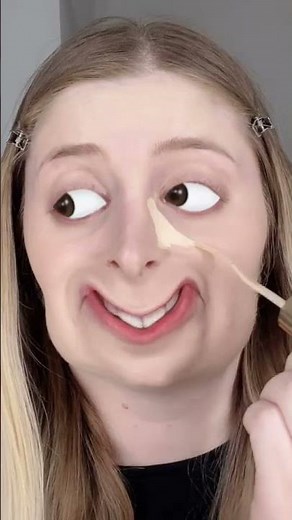 Paula applies makeup with a filter