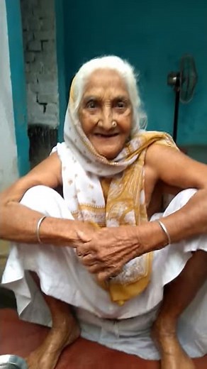 My sweet grandmother is laughing while she was bathing in the morning at village on 7th june 2017