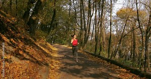 girl makes a run on the road. training. jogging. master shot. front view