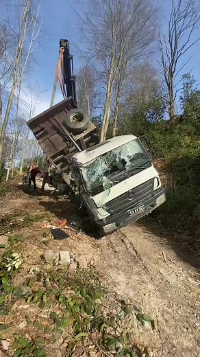 Tow Truck Rescue Operation for Tipped Mercedes Truck