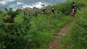 On the coastal path today; plenty of hills with a couple of down pours to keep these Marines cool on their 16.64 miles thanks to K Coy 42 Commando. | Royal Marines Commando 80 Challenge