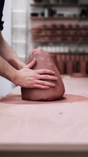 Spiral wedging, a process I do at least a few times a week with clay reclaimed from the trimmings carved away from my pots. I step up onto some planks to raise me up to a higher level when doing this, that way I can use more of my upper body weight to push down with, so my arms work less, and I can work for longer. As for the condition of the clay, I tend to remove it from the plaster batt, peeling it away, when it’s perhaps a bit softer than what you might normally throw with. It should all hol