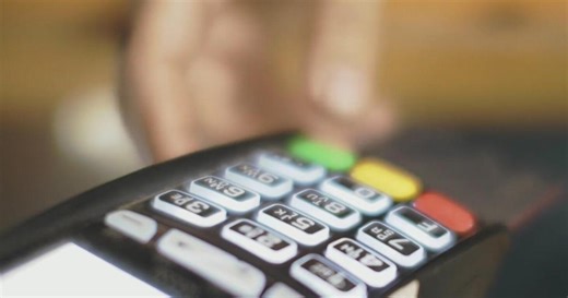 What is "ghost tap" credit card fraud?