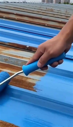 the process of painting asbestos roofs on buildings that have a rusty color #construction #popular