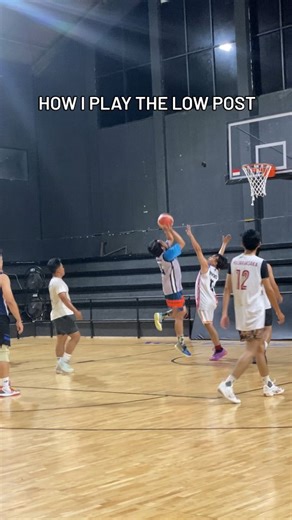 papopuyz | basketball on Instagram: "Low post basketball involves playing with your back to the basket near the painted area (low blocks) to score, draw fouls, or create passing angles. Key fundamentals include maintaining a low, wide stance, strong sealing (initiating contact), and mastering moves like the drop step, jump hook, and up-and-under. It requires physical play to establish position and agility to execute, often serving as a primary offense for big men or a tool to collapse the defens