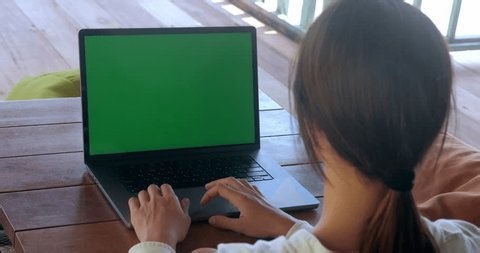 clip-3998922577-rear-view-woman-coffee-shop-working-on