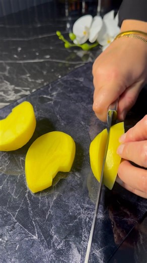 This sea bass slides into the oven and returns like a calm wave meeting warm sand — tender, fragrant, and beautifully golden. Each bite carries a quiet whisper of the sea, lifted by lemon, garlic, and a drizzle of good olive oil. Perfect for nights when you want something elegant yet effortless… a gentle feast that feels like it cooks itself. 🐚🍋🔥 #recipe #fish | Sati’s Tasty Kitchen