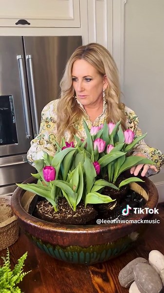 Spring DIY Centerpiece with Flowers, Rocks, and Moss