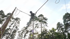 Bungee jumping background. Boy jumping on bungee. Happy boy flying high on jumping bungee rope. Happy childhood concept. Positive emotions. Summer vacation with children. Summer holidays concept