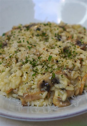 Creamy Mushroom Risotto made the traditional way! Slow-cooked Arborio rice with sautéed mushrooms, garlic, onion, white wine, Parmesan, and butter for a rich, velvety finish. Every bite is pure comfort. Save this recipe and make it for your next cozy dinner! #food #risotto #foodtok #recipes #italianfood