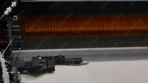 weaving loom at a textile factory, close-up. industrial fabric production line. the camera is stationary