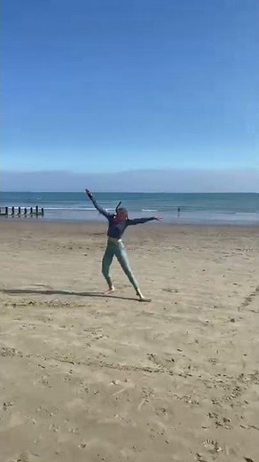 Girl Executes No-hands Side Flip Sequence at Beach-1332421