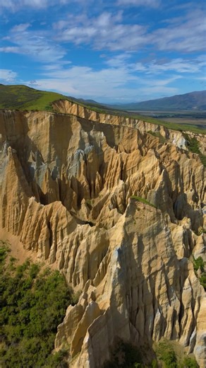 89K views · 1.1K reactions | The incredible Omarama Clay Cliffs in Waitaki, New Zealand. These unique natural rock formations with giant pinnacles are made of gravel and silt from ancient glaciers. Add it to your road trip itinerary for the South Island  #newzealandtravel #travelwithme #nature #dronevideo | A Sense of Huber | Facebook
