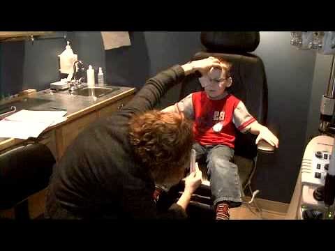 A 5 Year Old Patient Receiving An Eye Exam