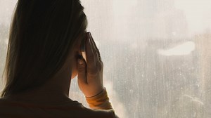 On the phone by a window - Free Stock Video