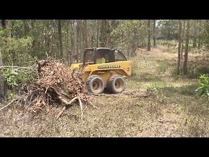 Remove shrubbery, brush and overgrowth with the Digga Root Rake attachment