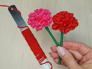 How to make a simple yarn flower using a ruler - CRAFTMANIA