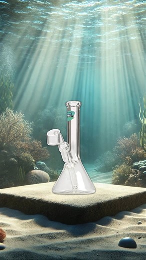 🦈 COMPACT HIT. CLEAN FUNCTION. 🦈 The Threshershark 6" Mini Beaker Rig is all about big performance in a small package — American-made from premium borosilicate glass with a sturdy 6 mm thick build that feels solid and smooth in every session. Perfect for anyone who wants reliable function without taking up desk or shelf space. Whether you’re focused on quick sessions or showcasing clean glass art, this rig delivers smooth pulls with consistent airflow. 💎 6" mini beaker design 💪 6 mm thick Am