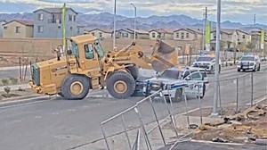 Suspect Goes Full Grand Theft Auto, Tries Running Over Cos with a Front End Loader Henderson police on Wednesday released video footage showing officers firing multiple shots at a suspect who authorities say drove stolen construction equipment directly at officers during an encounter on Water Street. Deputy Chief Matthew Murnane led a briefing detailing the officer-involved shooting, which occurred Sunday morning. Murnane identified the suspect as 33-year-old Juan Rincon Carreno. According to po