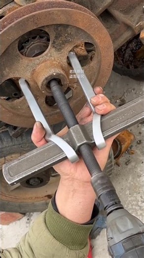 2-jaw gear puller being used to remove a component from a shaft