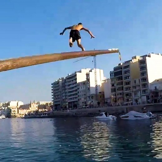 To win the Maltese game of Gostra you must successfully run to the end of a greasy pole and capture a flag! 🚩 | Culture Trip