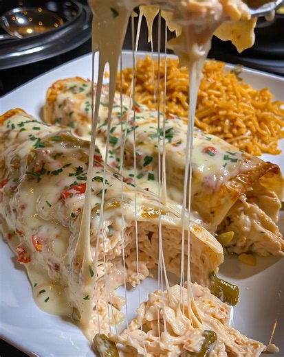 7.7M views · 12K reactions | Cheesy, creamy, and full of flavor—these Queso Chicken Enchiladas are pure comfort food. Rolled tortillas stuffed with tender chicken and smothered in rich queso sauce make this recipe a family favorite every time. .............. Full Recipe in Coʍmеոτ  | Donerecipe by Sarah | Facebook