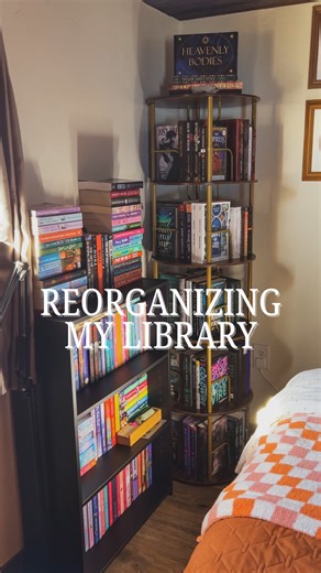Hails | Bookstagram on Instagram: "Reorganizing my library (in my tiny house) 📚 ✨Thank you @flycitymall for the gifted 5-tier rotating shelf! Maybe you didn’t know this, but I’ve been living in a tiny house and most of my books have been in disarray: disorganized book stacks everywhere and no space to display some of my most treasured books. I’m so obsessed with how the rotating shelf allows me to show off more of my book babies! Truly I can’t get over how much it has elevated my library! 📚 ✨ 