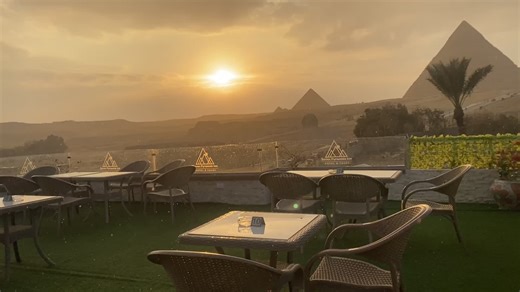 A breathtaking view from Seven Pyramids View Inn during sunset, where golden rays illuminate the pyramids as gentle rain adds a magical touch to the scene. An unforgettable experience for nature lovers and those seeking tranquility. For bookings and inquiries, contact us via WhatsApp: 201022757549. #SevenPyramidsViewInn #PyramidsSunset #MagicalView #RainAndSunset #GizaPyramids #BreathtakingMoments #EgyptTravel #UnforgettableExperience #PyramidsView #VisitEgypt@SevenPyramidsInn