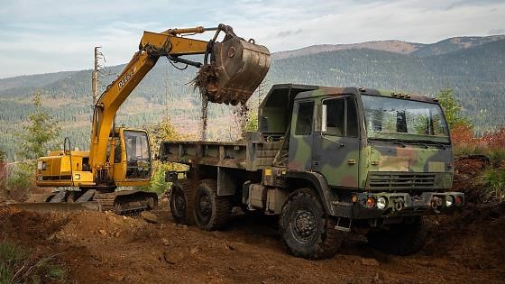 Building a road to my mountain with a 6x6 dump truck
