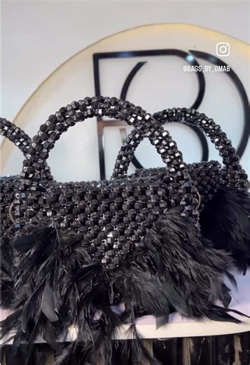 Elegance in every detail ✨ Feathered, beaded, and made to turn heads😍 Which outfit would you pair this with? Price: 40,000 only 📌it comes with a detachable chain 📌To place order kindly send a dm or click on the link in our bio #bagsbyomab #handmadebagsinlagos #beadedbagsinlagos #explore #madeinnigeria #beadbaglovers #fashionbags #fyp #handmadebags #creatorsearchinsights