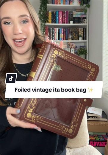 A ita laptop/bookbag that looks like a vintage book?? This is the cutest way to display enamel pins without them damaging your bag. Gold detailing, adjustable strap, multiple pockets, and it actually fits my laptop. #itabag #laptopbag #BookBag #EnamelPins #FantasyAesthetic @Moon Rose Cafe