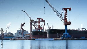 Timelapse large engineering shipyard shipbuilding manufacturing, The construction of a ship with cranes. A fragment of the case in the workshop of the plant. Metal frame during assembly from above
