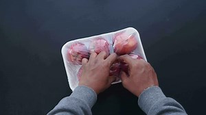 Download apples wrapped in transparent plastic. for free