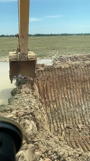 Excavator Digging in Open Field: Watch this Heavy Machinery