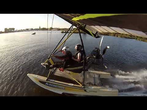 Powered hang glider takes off from water