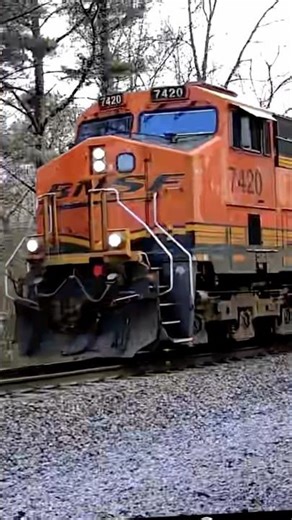 Huge BNSF manifest train with transformer trailing