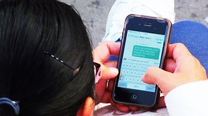 How is the SMS sent from the smartphone transmitted in the way?