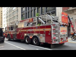 FDNY Ladder 25 Responding Urgently From Their Firehouse On West 77th Street In Manhattan NYC