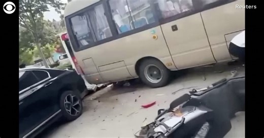 Bus crashes into students and parents outside China school, killing 11