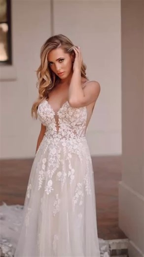✨ Boho Glam, But Make It Breathtaking ✨ Say hello to this gorgeous beaded and floral lace wedding dress — a dreamy blend of effortless glamour and bohemian magic. With its delicately beaded shoestring straps, plunging V-neckline and wide open back with a soft keyhole feature, this gown is made for the bride who wants to feel ethereal, feminine and beautifully free. 🌿 Why Brides Love It: • Sheer bodice covered in vine floral lace • Soft, relaxed A-line silhouette • Layers of sequin beaded tulle 