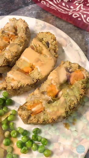 Holiday Dinner just got easier! This gluten-free roast is hearty, savory, and packed with flavor. Chickpeas, tofu, roasted veggies, and a maple-balsamic glaze… so good with all your sides. Recipe in the comments #veganthanksgiving #vegandinner #gfroast | Vegan Richa