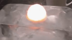 Watch What Happens When You Put A Red-Hot Nickel Ball On Ice