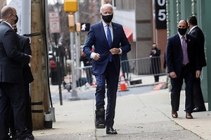 Biden seen walking in a boot after ankle sprain